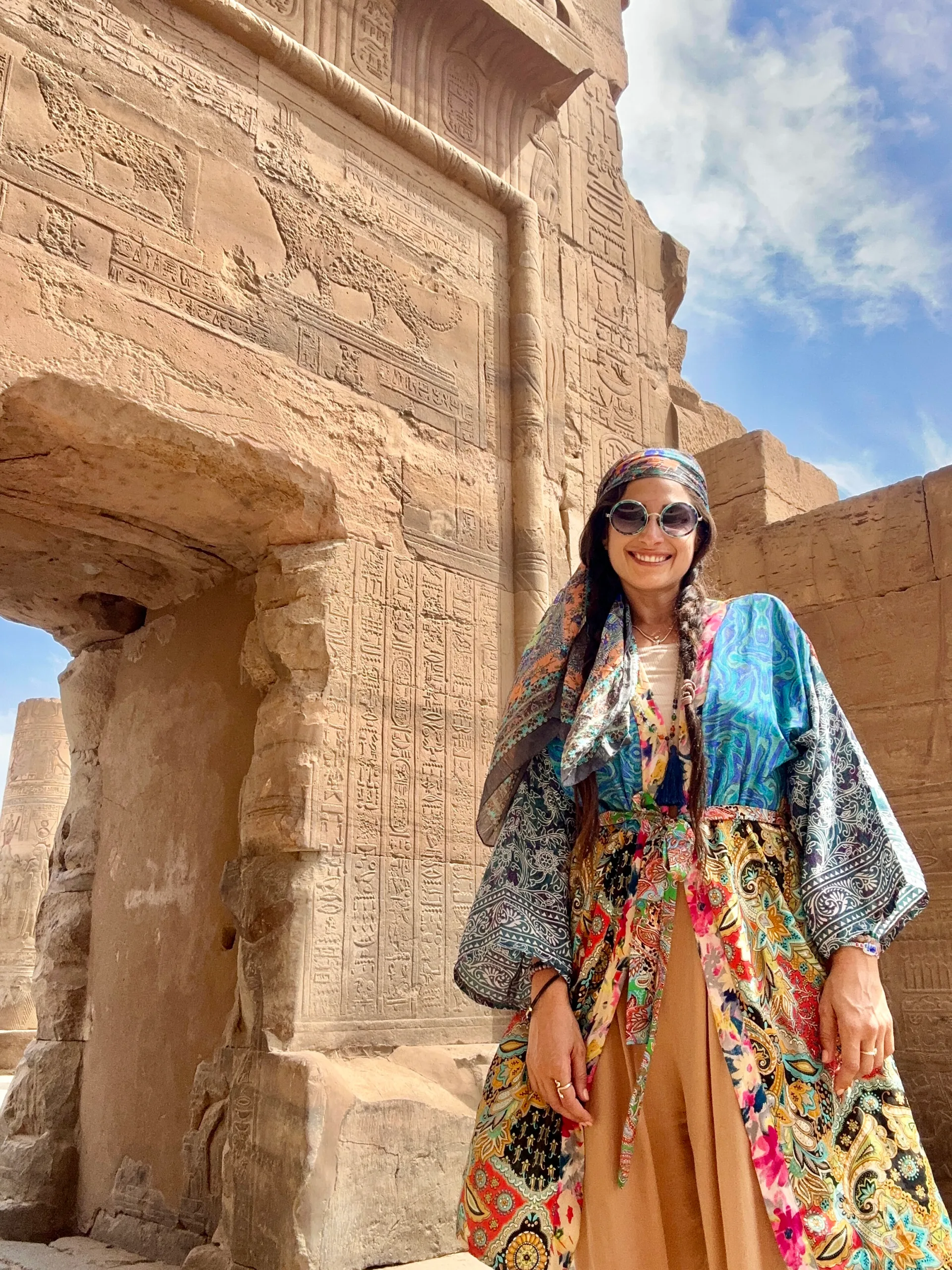 Amira Attar at an Egyptian temple, wearing a colorful kimono